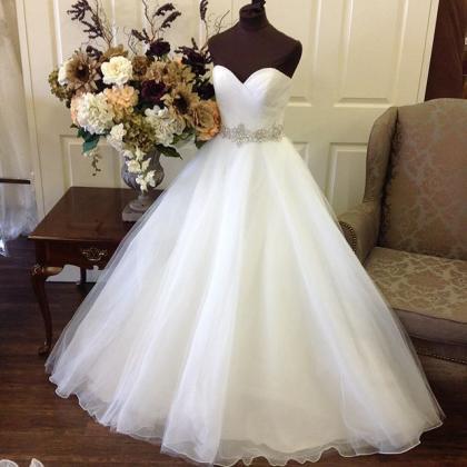 Elegant White Beaded Ruffle Organza Ball Gown..