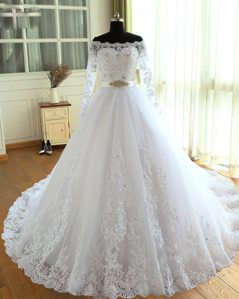 Women's all white elegant wedding tulle skirt gown with royal bodice and  full sleeves